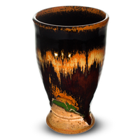 14 ounce handmade pottery cup in beautiful earth tone colors accented with red.  Hand made by Prairie Fire Pottery.