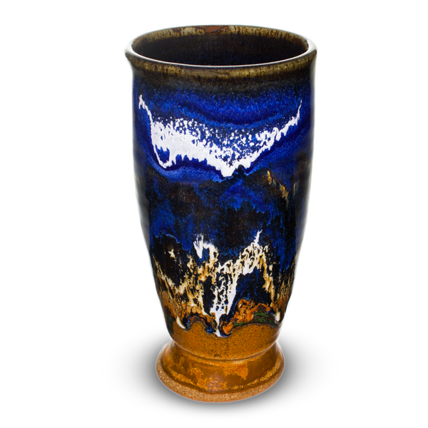 12 oz. handmade pottery tall cup in earth tones and blue, accented with white.  Hand made by Prairie Fire Pottery.