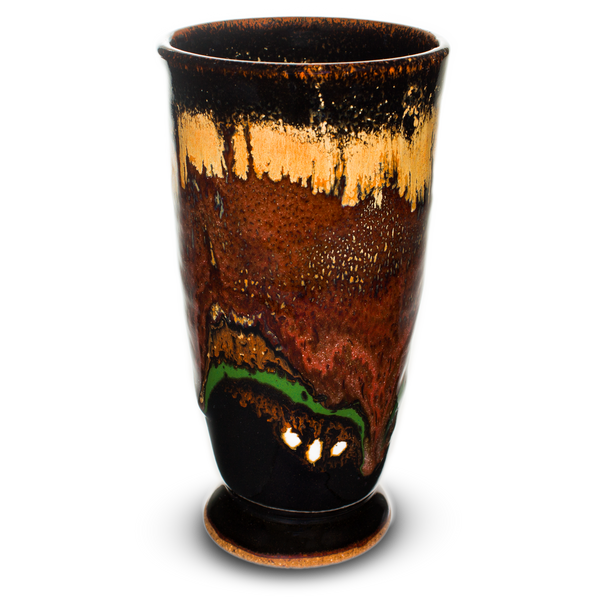7 inch tall handmade pottery cup in brick red and soft brown colors over black.  Hand made by Prairie Fire Pottery in stoneware clay.