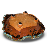 This is a 9 1/2 inch hand built bowl in turquoise and brown glazed color, accented with red. Handmade pottery stoneware clay by Prairie Fire Pottery. This is the back side view of the product.