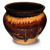 Beautiful toasted orange colors over red on a handmade pottery spoon crock. Hand made by Prairie Fire Pottery.