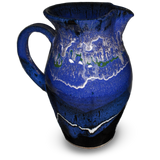 56 ounce handmade pottery pitcher in cobalt blue and black.  Wheel-thrown stoneware clay.  Hand made by Prairie Fire Pottery.  Left side view.