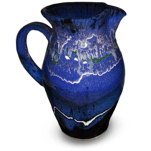 56 ounce handmade pottery pitcher in cobalt blue and black.  Wheel-thrown stoneware clay.  Hand made by Prairie Fire Pottery.  Left side view.