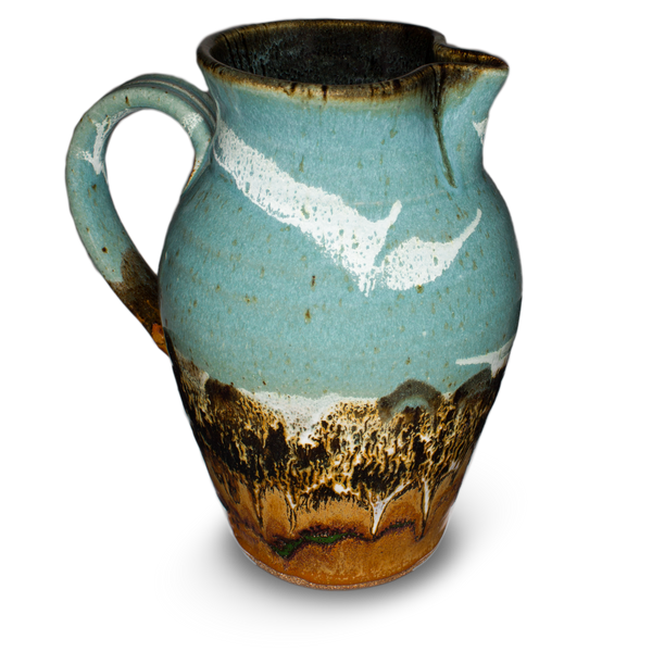 56 ounce high-fired wheel-thrown pitcher in turquoise and brown colors.  It is handmade pottery by Prairie Fire Pottery.  Hand made in stoneware clay.  Left side view.
