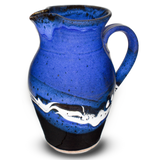 Beautiful blue and black handmade pottery pitcher. Capacity 56 ounces. Hand made and high-fired by Prairie Fire Pottery. Right side view.
