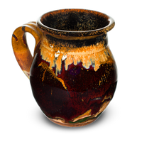 Beautiful 16 oz. handmade pottery mug.  Deep red and earth tone colors.  Hand made by Prairie Fire Pottery in the U.S.A.