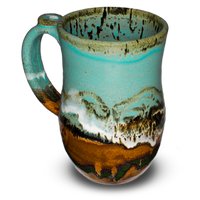 Glaze colors: turquoise-brown.  Handmade pottery stoneware mug.  20 ounce wheel-thrown pottery.  Left side view.