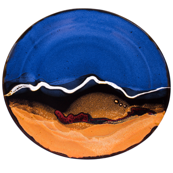 Rich blue over toasted orange colors accented with red.  Handmade pottery serving platter by Prairie Fire Pottery.