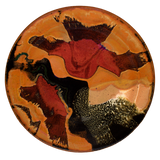 The glaze colors on the 14 inch stoneware platter are a beautiful blend of toasted orange, red, and dry yellow.  It is handmade pottery by Prairie Fire Pottery.  Hand made and high-fired to 2400°.  Made in the U.S.A. 