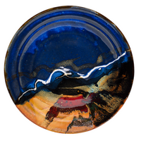 14 inch round serving platter in cobalt blue and  toasted orange colors.  Handmade pottery by Prairie Fire Pottery.  High-fired stoneware clay.  Hand made in the U.S.A.  Overhead view.
