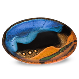 Small plate in cobalt blue-turquoise-brown.  Handmade pottery crafted in stoneware clay by Prairie Fire Pottery.  3/4 side view.