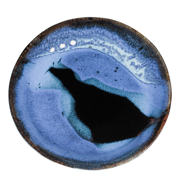 Small plate in light blue and black colors. Handmade pottery crafted in stoneware clay by Prairie Fire Pottery.  Overhead view.