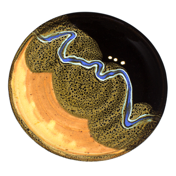 Dry yellow and black lunch plate accented with a meandering ribbon of blue.  Handmade pottery crafted by Prairie Fire Pottery in stoneware clay.  Overhead view.
