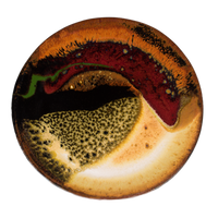 Small round plate in beautiful earth tone colors and red.  It's handmade pottery by Prairie Fire Pottery.  Hand crafted in stoneware clay and high-fired to 2400°.  Overhead view.