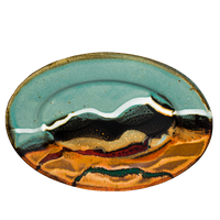9-inch oval stoneware plate. Turquoise-brown accented with red and teal. Handmade pottery from Prairie Fire Pottery. Hand made in the U.S.A.  Overhead view.
