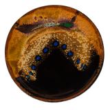 Small brown and black plate accented with blue dots.  Handmade pottery crafted in stoneware clay by Prairie Fire Pottery.  Overhead view.
