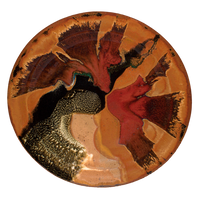 Stoneware serving platter.  14 inch diameter.  Beautiful colors, toasted orange, red, and black.  Handmade pottery by Prairie Fire Pottery.  Hand made in the U.S.A.  Overhead view.