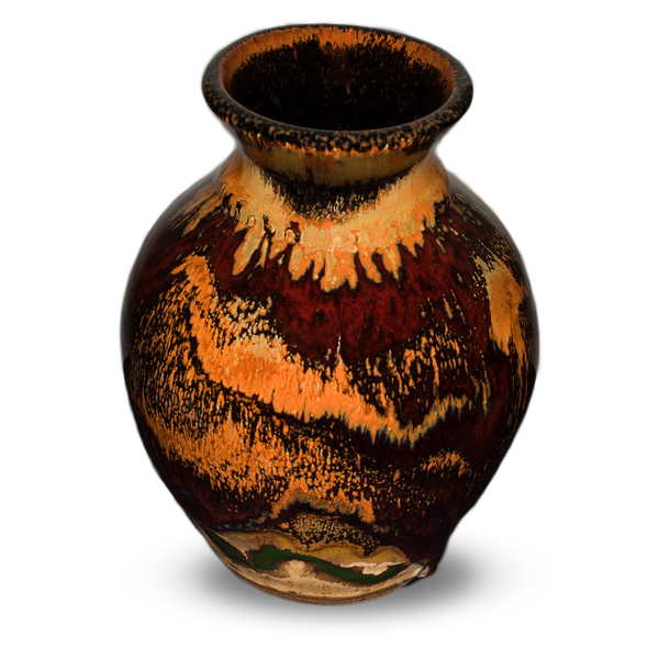 Flared-neck vase with a round body style.  It is glazed in earth tone colors and red.  It is handmade pottery by Prairie Fire Pottery.  Hand made in the U.S.A.