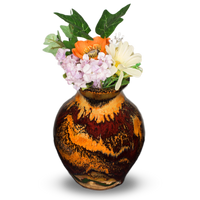 Flared-neck vase with a round body style. It is glazed in earth tone colors and red. It is handmade pottery by Prairie Fire Pottery. Hand made in the U.S.A.  Shown with a bouquet of garden flowers.