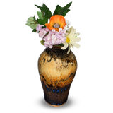 8 inch flared-neck vase in soft Calico colors. It's handmade pottery by Prairie Fire Pottery.  This view is the vase holding garden flowers.
