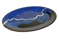 Beautiful cobalt blue and black oval plate.  Handmade pottery by Prairie Fire Pottery.  3/4 view.